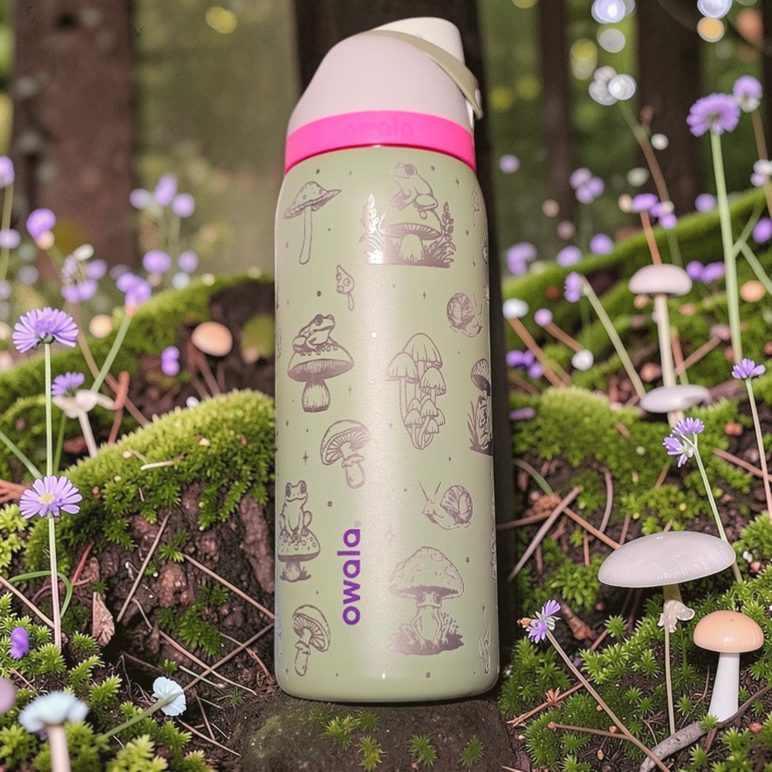 Green water bottle with mushroom design in a forest setting