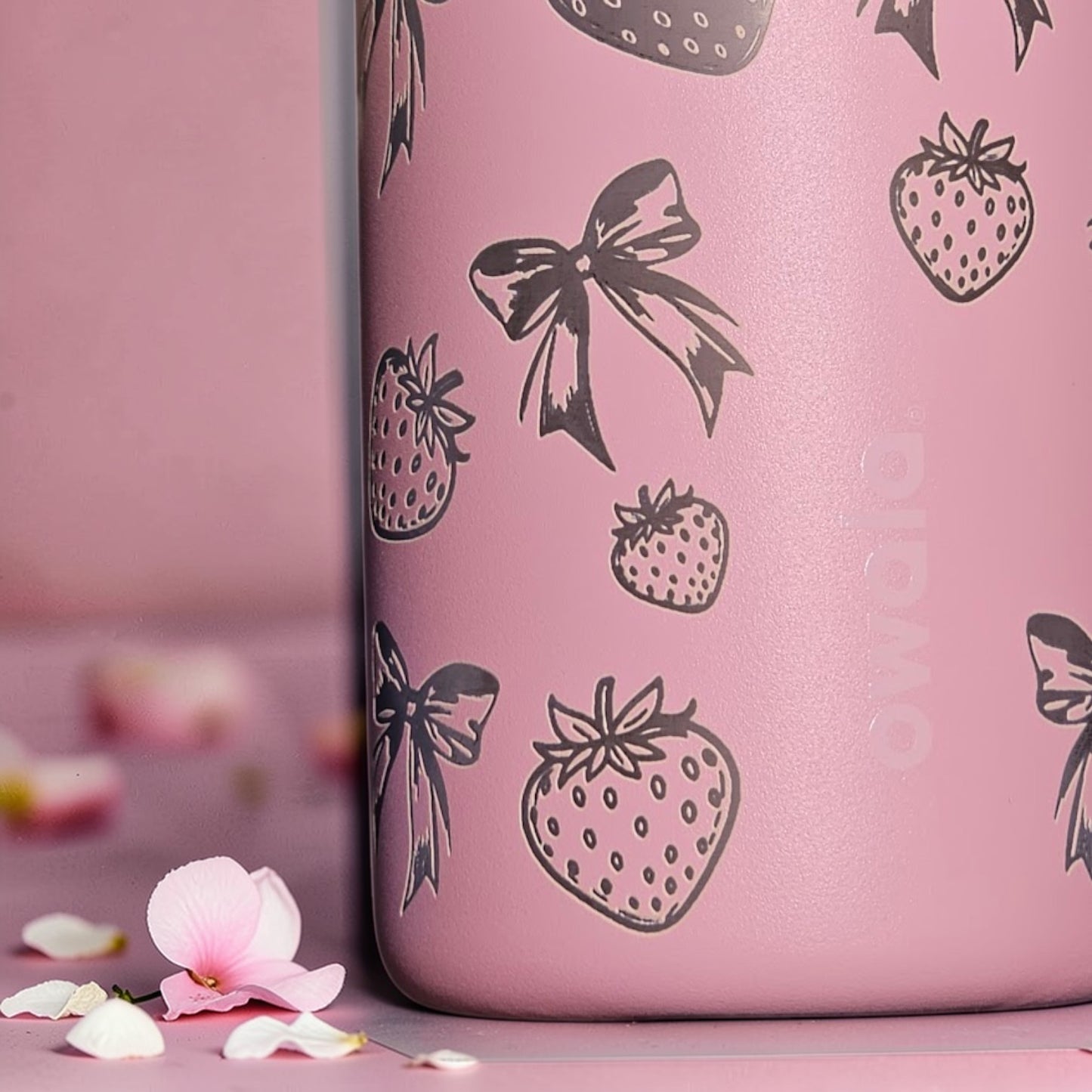 Pink Owala bottle with silver strawberries and bows